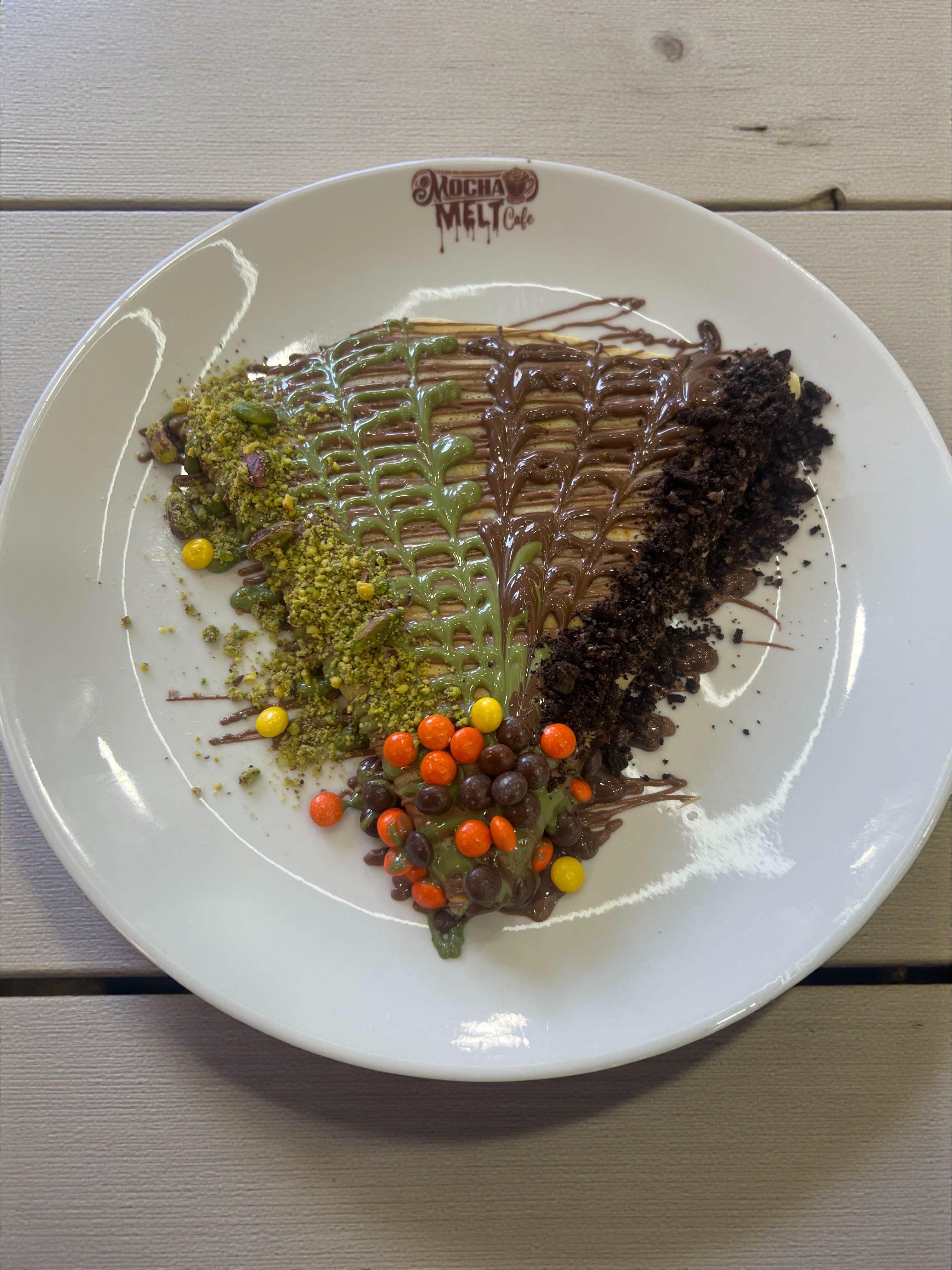 Old City Crepe with pistachio, chocolate, cookie crumble, and candy toppings